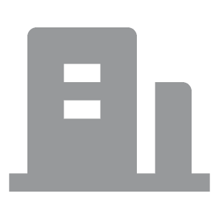 Gray, simplistic icon of a building with two square windows and a rectangular extension, representing a generic office or urban structure.